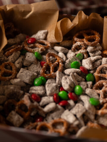 A moody shot of reindeer chow in a festive tin.