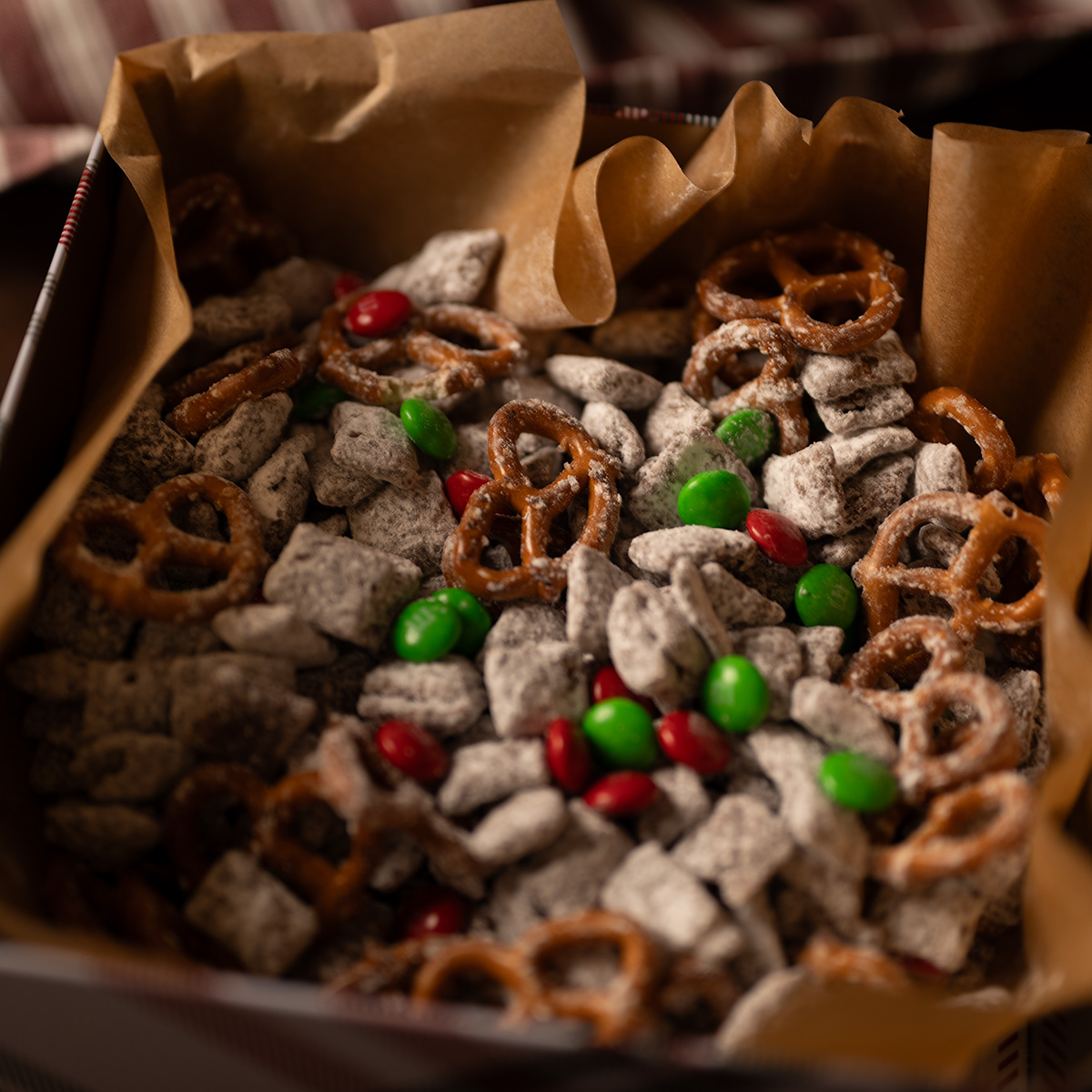 A moody shot of reindeer chow in a festive tin.