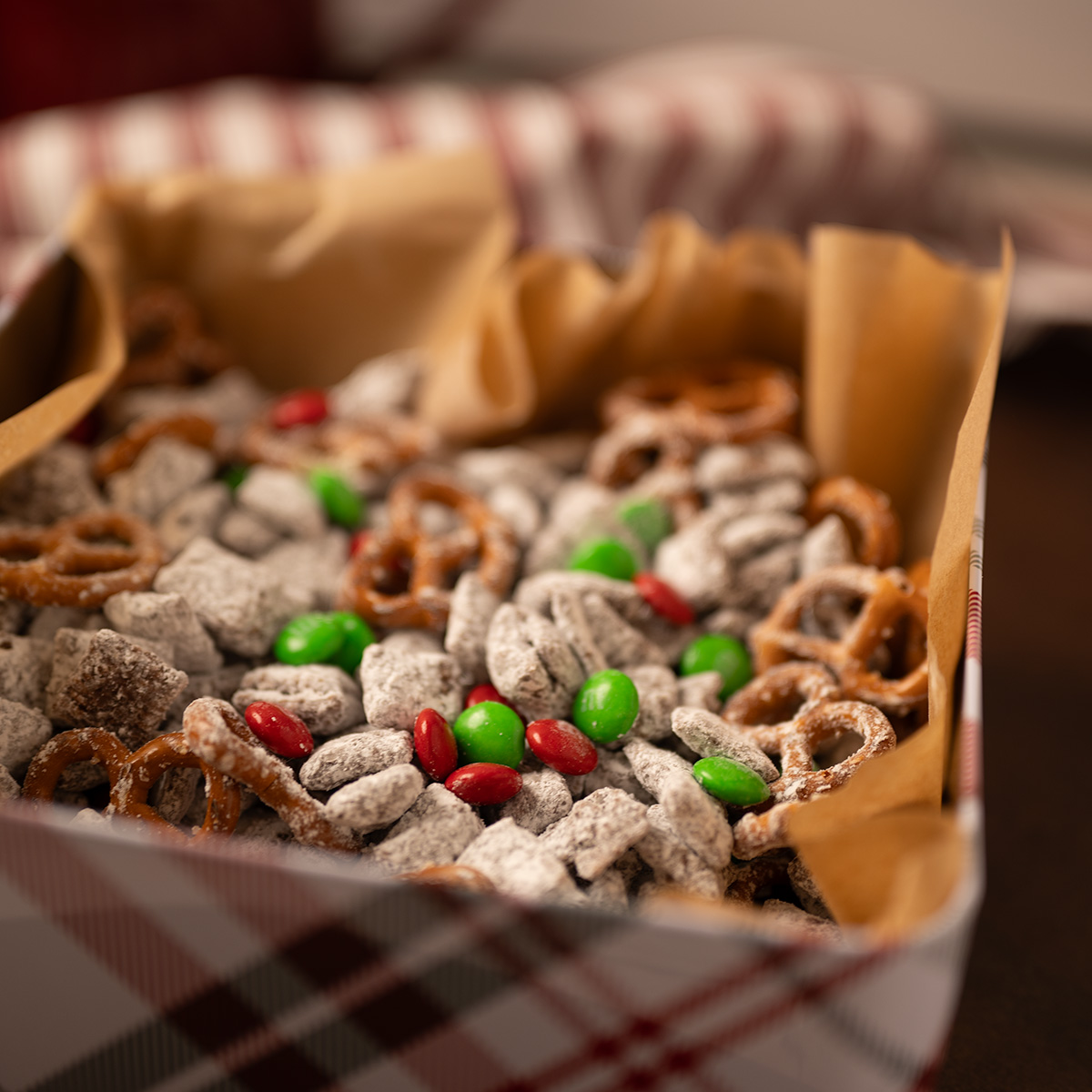 Bright picture of reindeer chow in a festive tin.