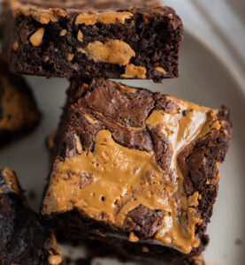 A close up of two peanut butter brownies.