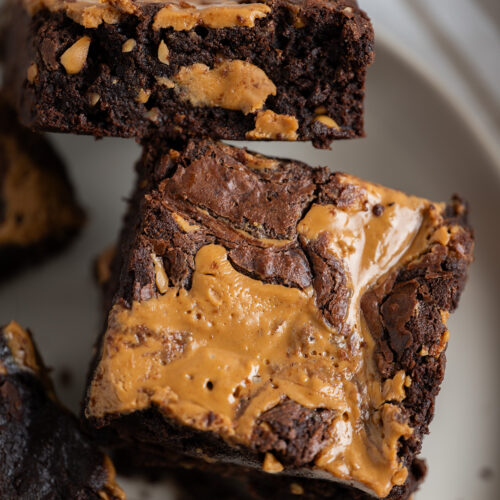 A close up of two peanut butter brownies.