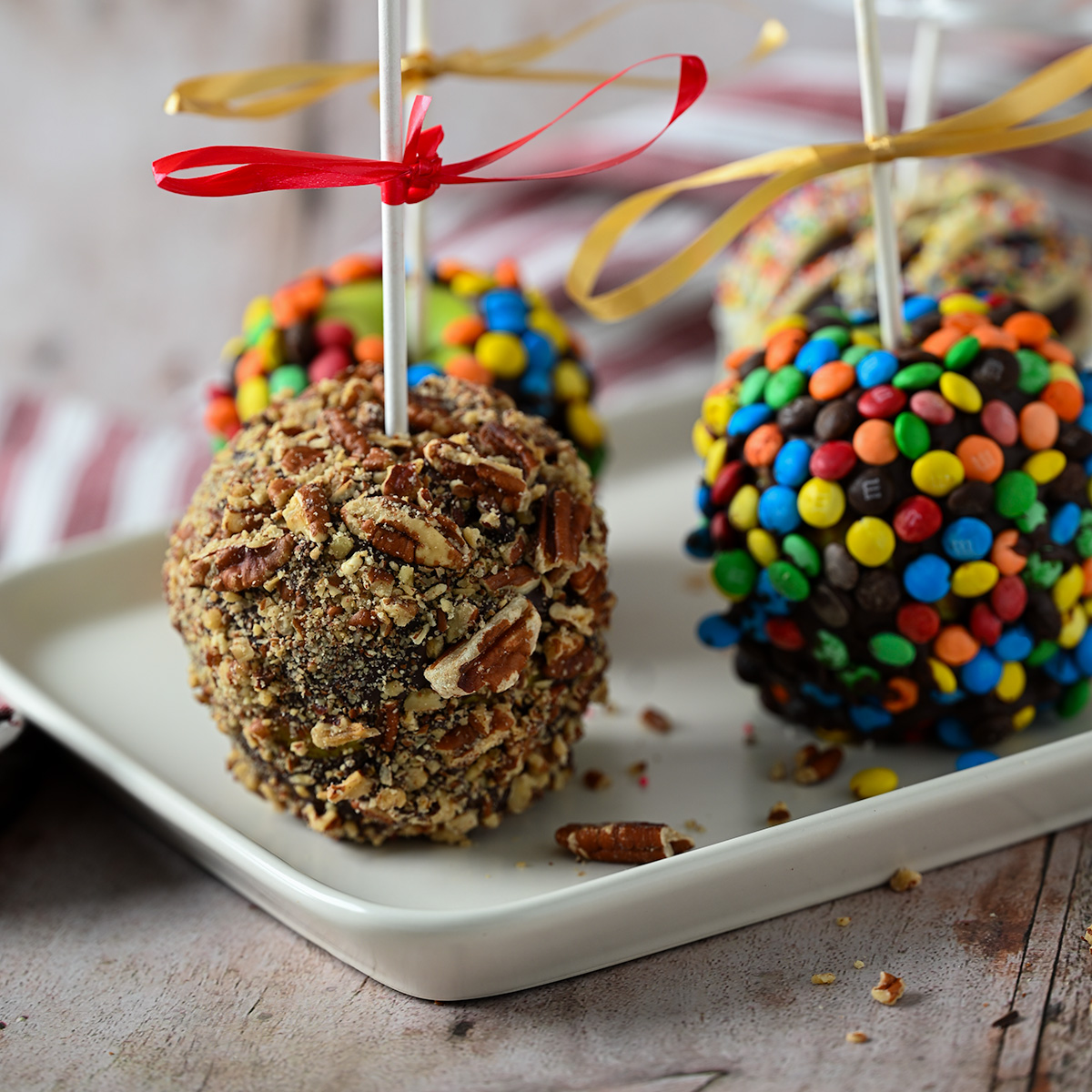 Pecan and M&M chocolate caramel apples.